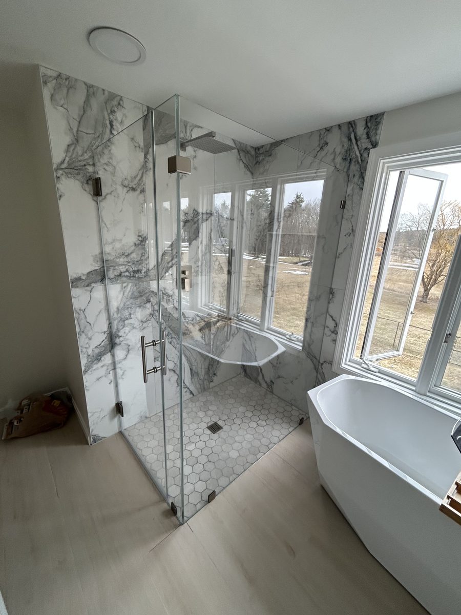 corner frameless shower enclosure chrome hardware dramatic marble tile Peabody MA